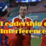 Sanjiv Goenka watching Lucknow Super Giants during an IPL match while players discuss tactics on the field